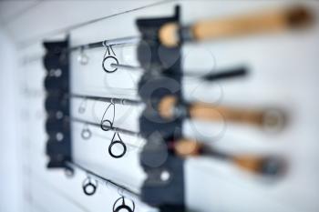 fishing gear hanging on hook in a shed