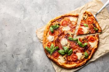 Delicious pizza on grey background�