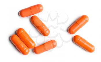 Colorful pills on white background�