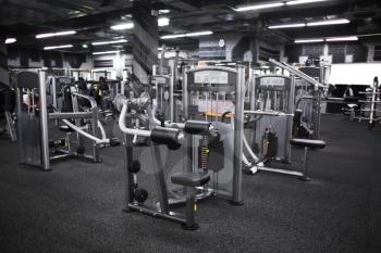 Modern equipment in new gym indoors�