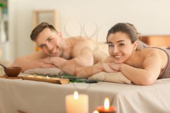 Young couple relaxing in spa salon�