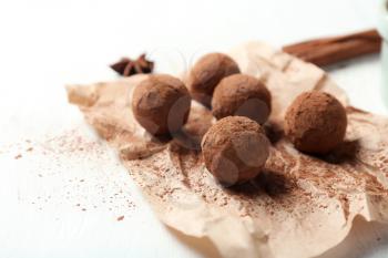 Tasty chocolate truffles on white table, closeup�