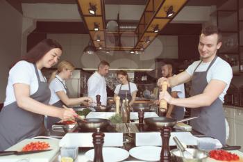 Chef and group of young people during cooking classes�
