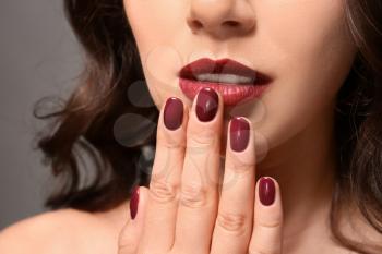 Beautiful young woman with professional manicure, closeup�