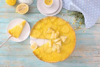 Composition with tasty lemon pie on wooden table�