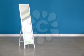 Large mirror near color wall�