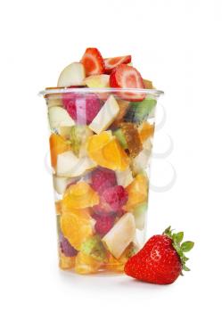 Delicious fruit salad in plastic cup on white background�