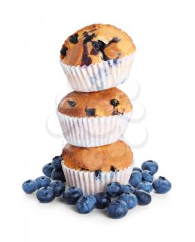 Stack of tasty blueberry muffins on white background�