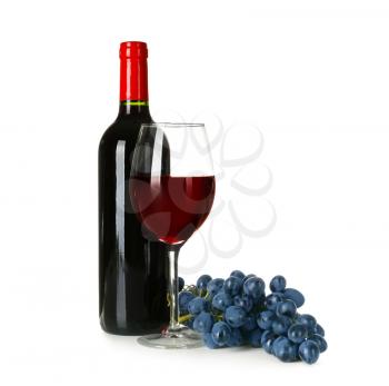 Bottle and glass of red wine with ripe grapes on white background�
