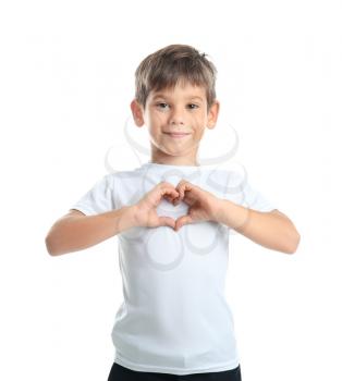 Cute little boy in t-shirt making heart with his hands on white background�