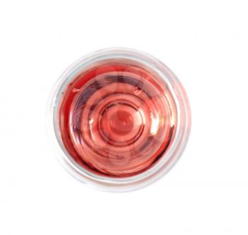 Glass of pink wine on white background, top view�