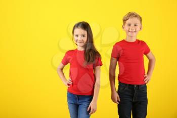 Cute children in t-shirts on color background�