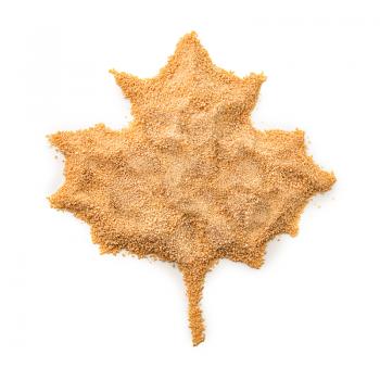 Maple leaf made with granulated sugar on white background�