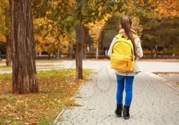 Cute girl with backpack going to school�