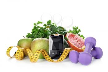 Digital glucometer with measuring tape, dumbbells and healthy food on white background. Diabetes diet�
