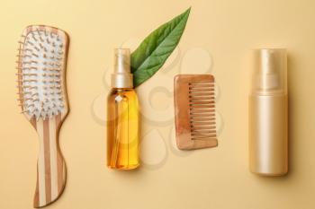 Flat lay composition with cosmetics for hair on color background�