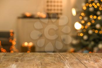 Closeup view of wooden table against blurred Christmas interior�
