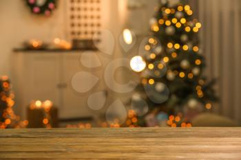 Closeup view of wooden table against blurred Christmas interior�
