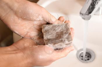 Man washing hands with soap, closeup�