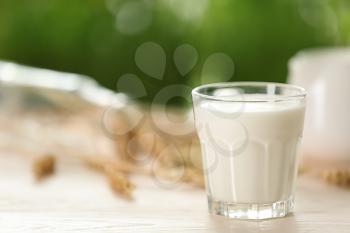 Glass of fresh milk on light table�
