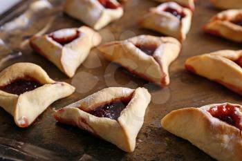 Tasty hamantaschen for Purim holiday on metal tray�