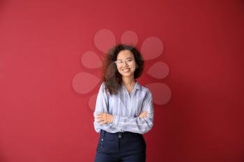 Portrait of young businesswoman on color background�
