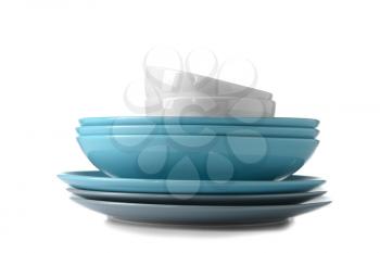 Set of clean dishes on white background�