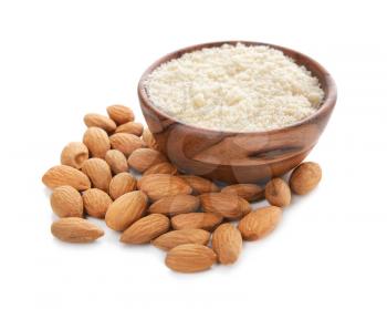 Bowl with almond flour on white background�