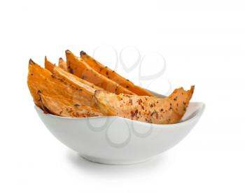 Bowl with tasty baked sweet potato on white background�