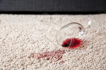 Glass of wine spilled on carpet�