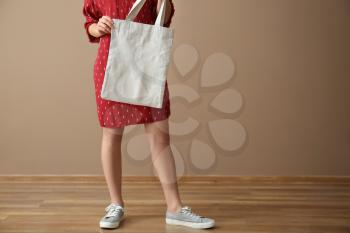 Young woman with eco bag indoors�