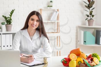 Portrait of female nutritionist in her office�
