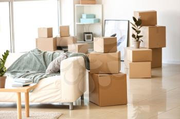Furniture, belongings and moving boxes in room�