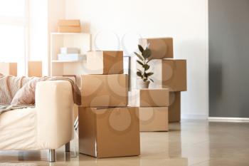 Moving boxes with belongings in room�