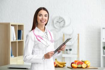 Portrait of female nutritionist in her office�