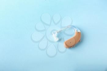 Hearing aid on color background�