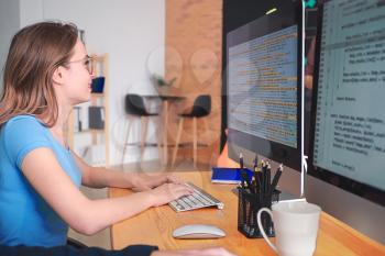 Female programmer working in office�