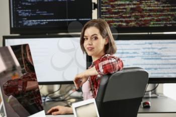 Female programmer working in office�