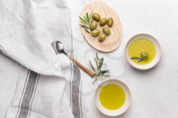 Tasty olive oil on light table�