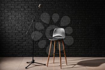 Microphone with chair in studio�