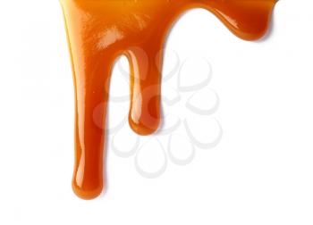 Stains of liquid caramel on white background�