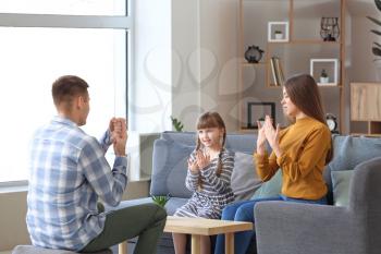 Deaf mute family using sign language at home�