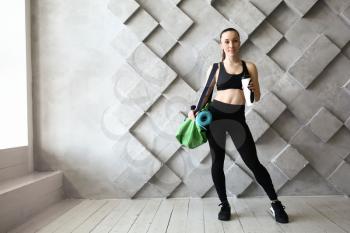 Sporty woman with bag in gym�