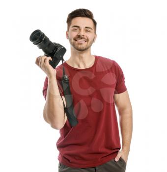 Young male photographer on white background�