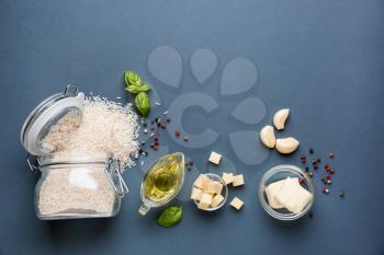 Raw ingredients for risotto on grey background�