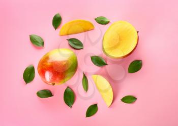 Tasty fresh mango on color background�