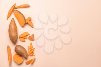 Fresh sweet potatoes on light background�