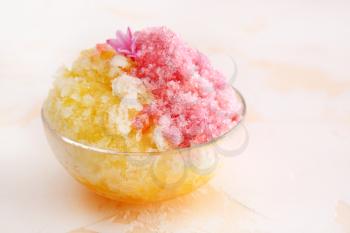 Bowl with tasty shaved ice on light table�
