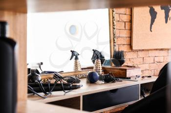 Hairdresser tools on table in beauty salon�