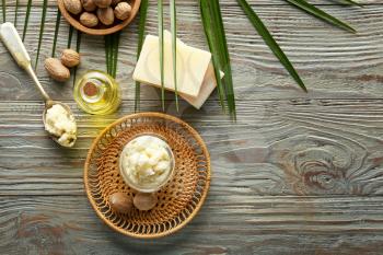 Composition with shea butter on wooden background�